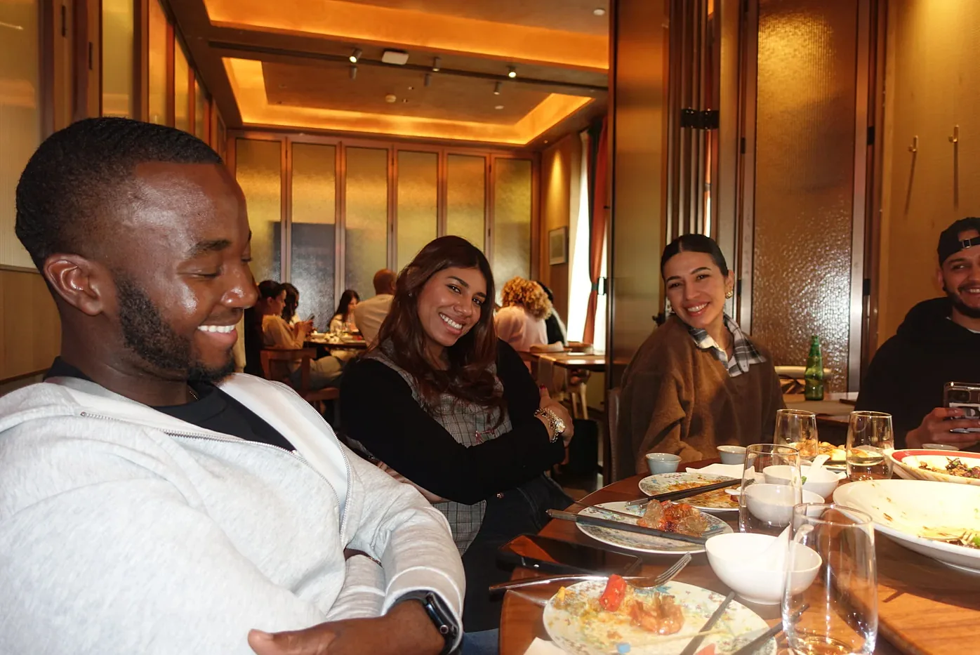 Travel & LIV travelers sharing an evening dinner toast on a previous trip