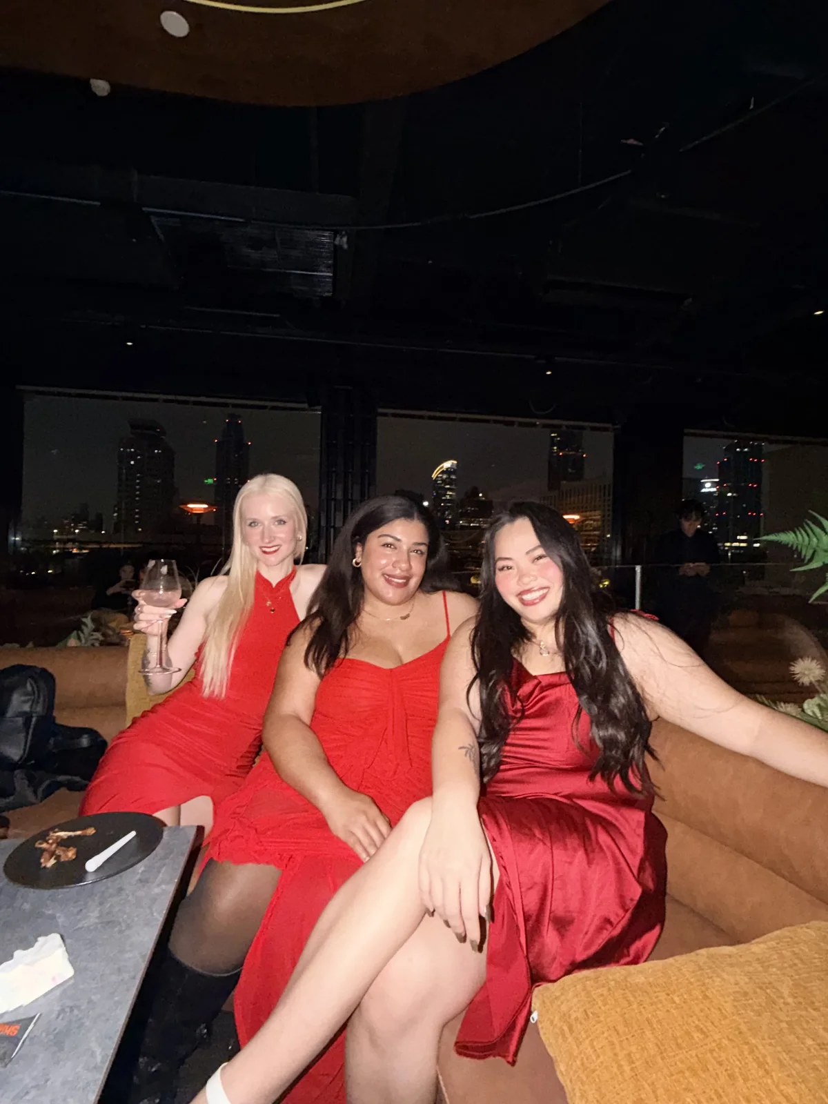 Three friends dressed up for an evening out together